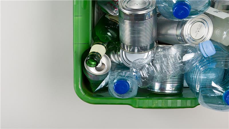 Recyclable packaging containers and bottles in recycle bin